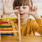 front-view-child-using-abacus-learn-how-count (1)5